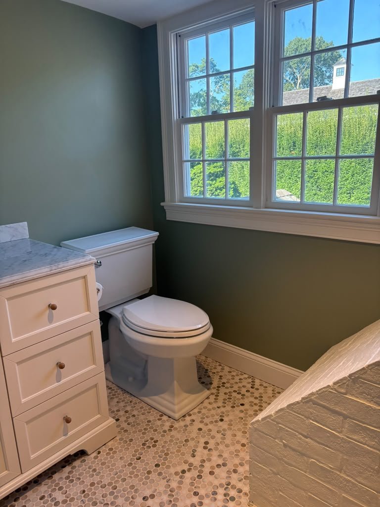 Bathroom with new vanity, window and penny-tile floor