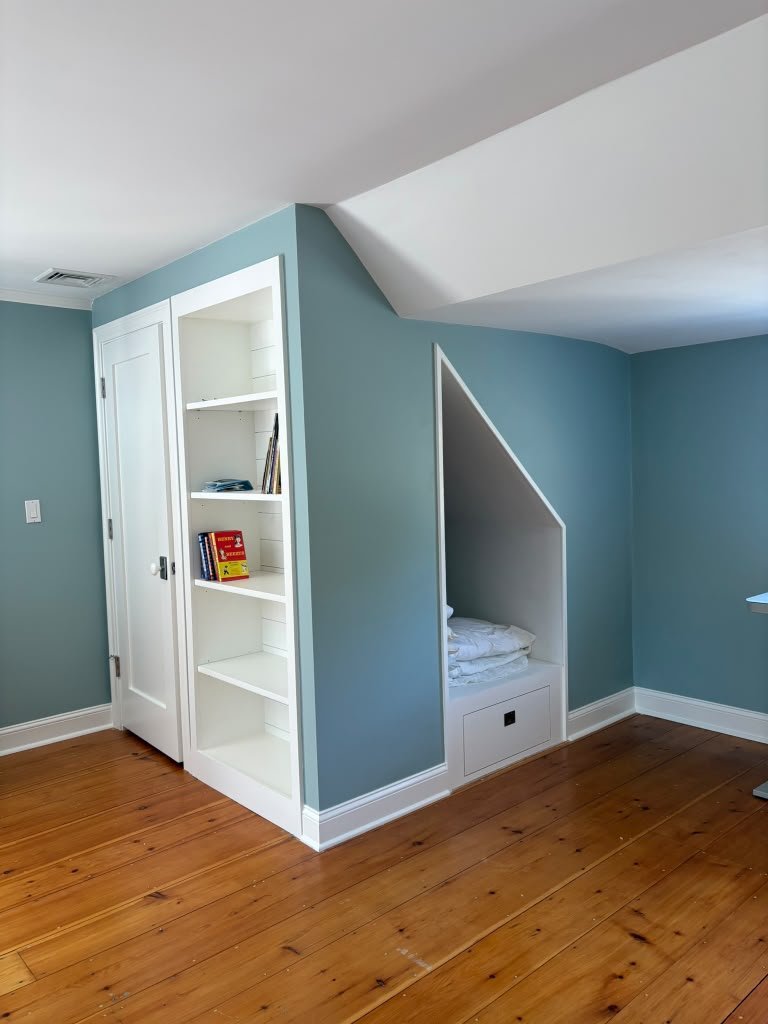 Built-in bookcase and under-eave reading nook