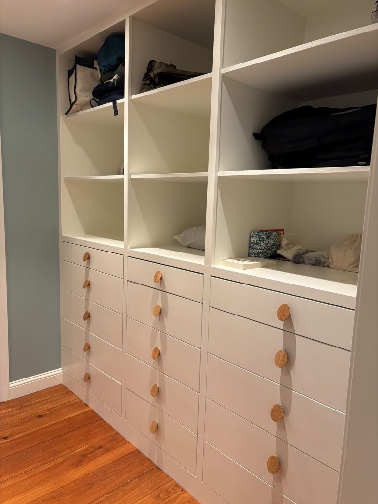Built-in storage with drawers and wood knobs