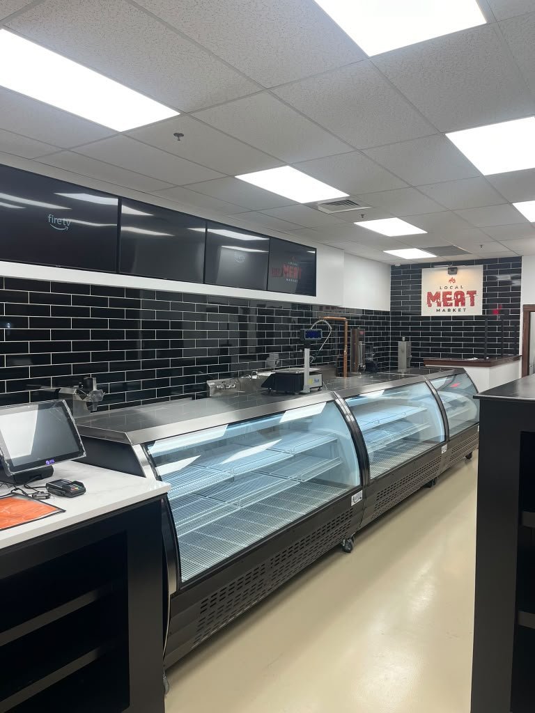 Commercial meat market buildout with display counter and tile walls